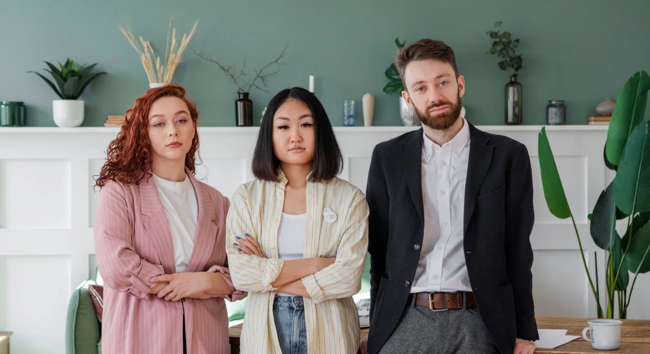 The Vibebes team reviewing work together around a meeting table